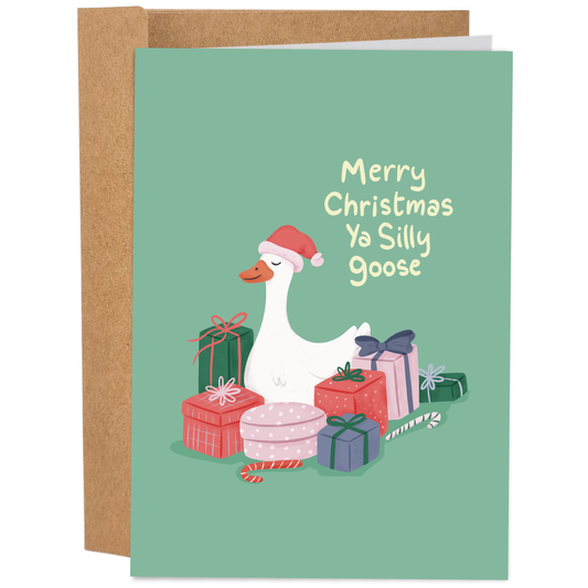 Good Egg Greetings Christmas card with a goose wearing a Santa hat and surrounded by presents on a green background.