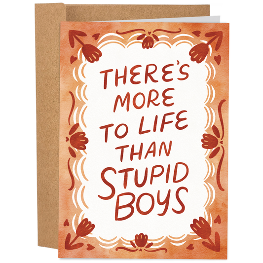 Good Egg Greetings Galentine's Day Greeting card with decorative border and text 'THERE'S MORE TO LIFE THAN STUPID BOYS' on a white background.