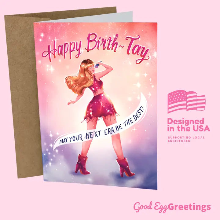 Good Egg Greetings Birthday card with a stylized illustration of a Taylor Swift and 'Happy Birth-Day' text, with a visible 'Good Egg Greetings' logo.
